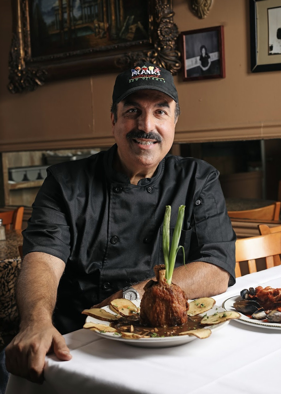 The man is sitting at the table